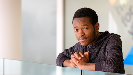 Young male student looking at the camera  