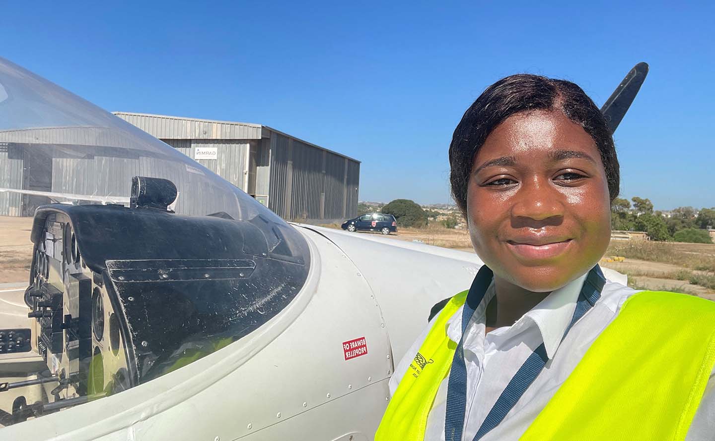 Josephine Tsiagbe by a plane
