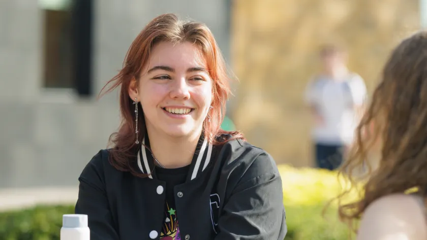 Student smiling in the sunshine
