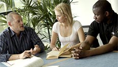 Staff and students in a meeting