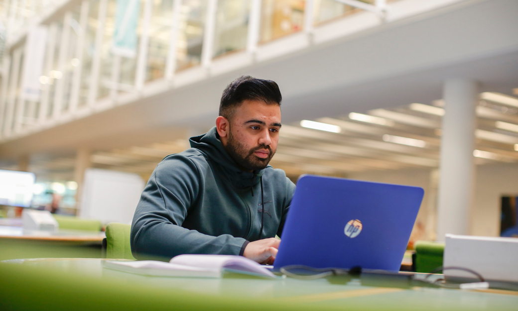 student studying on laptop in LRC