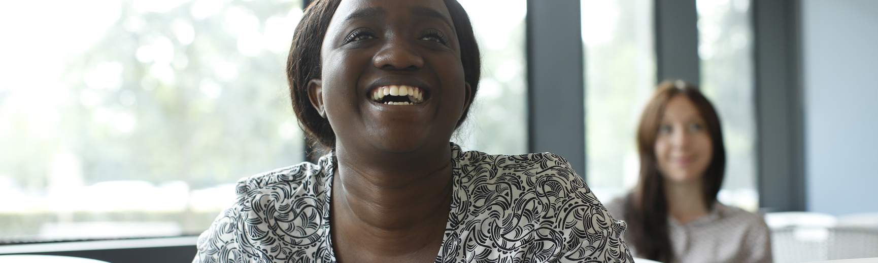 Female student laughing in class