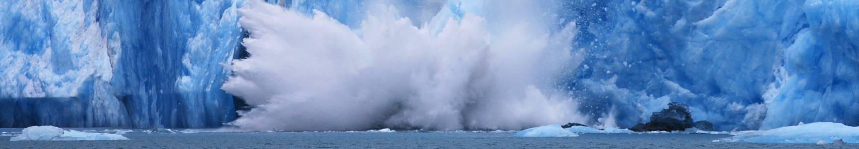 glaciers melting and crashing into the ocean