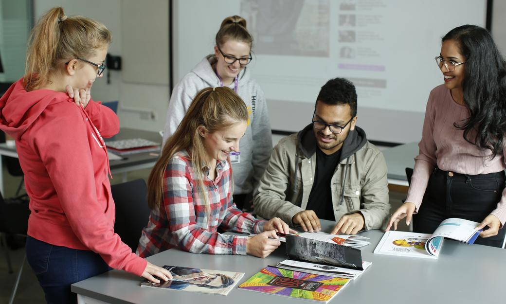 a group of students working together in a classroom