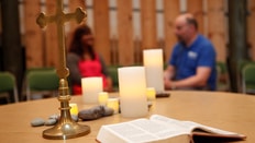 Two people talking in the Key multi-faith centre