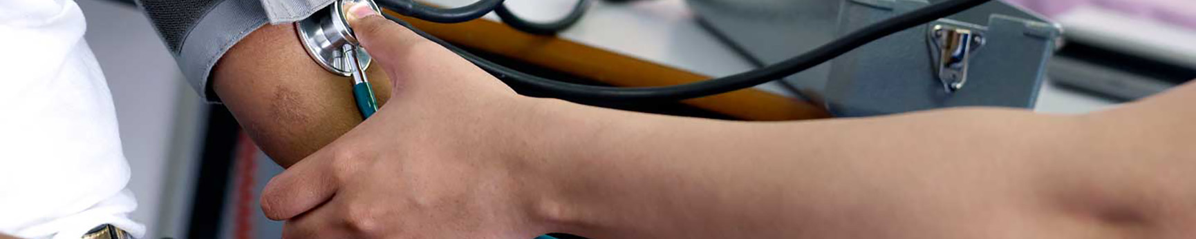 Doctor taking blood pressure of patient