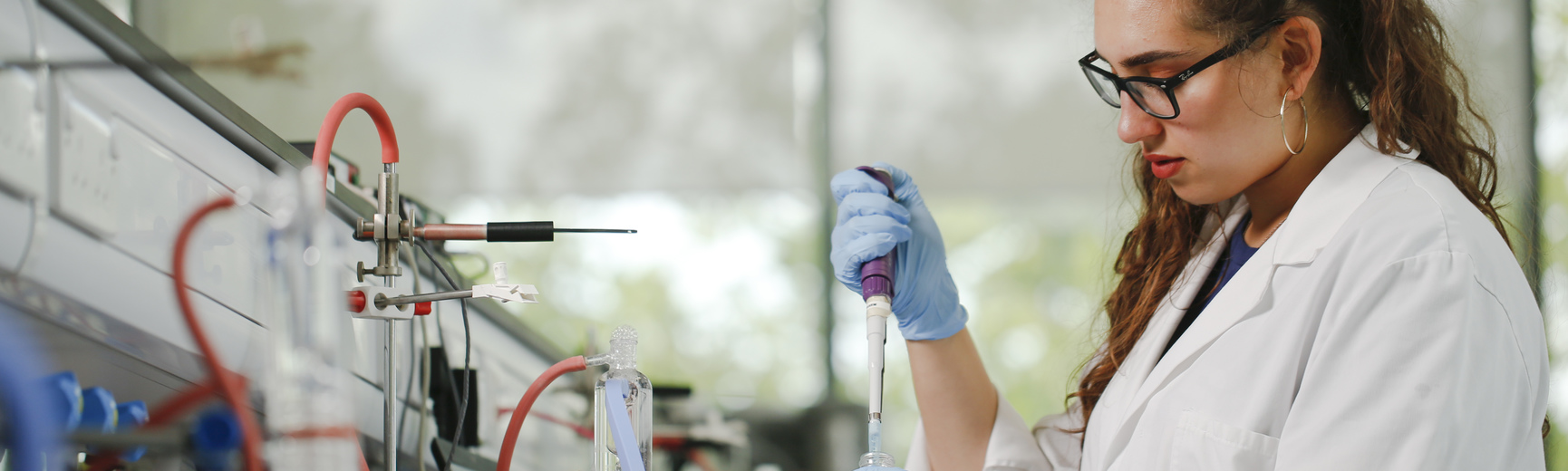 Female student using syringe 