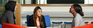 three students chatting