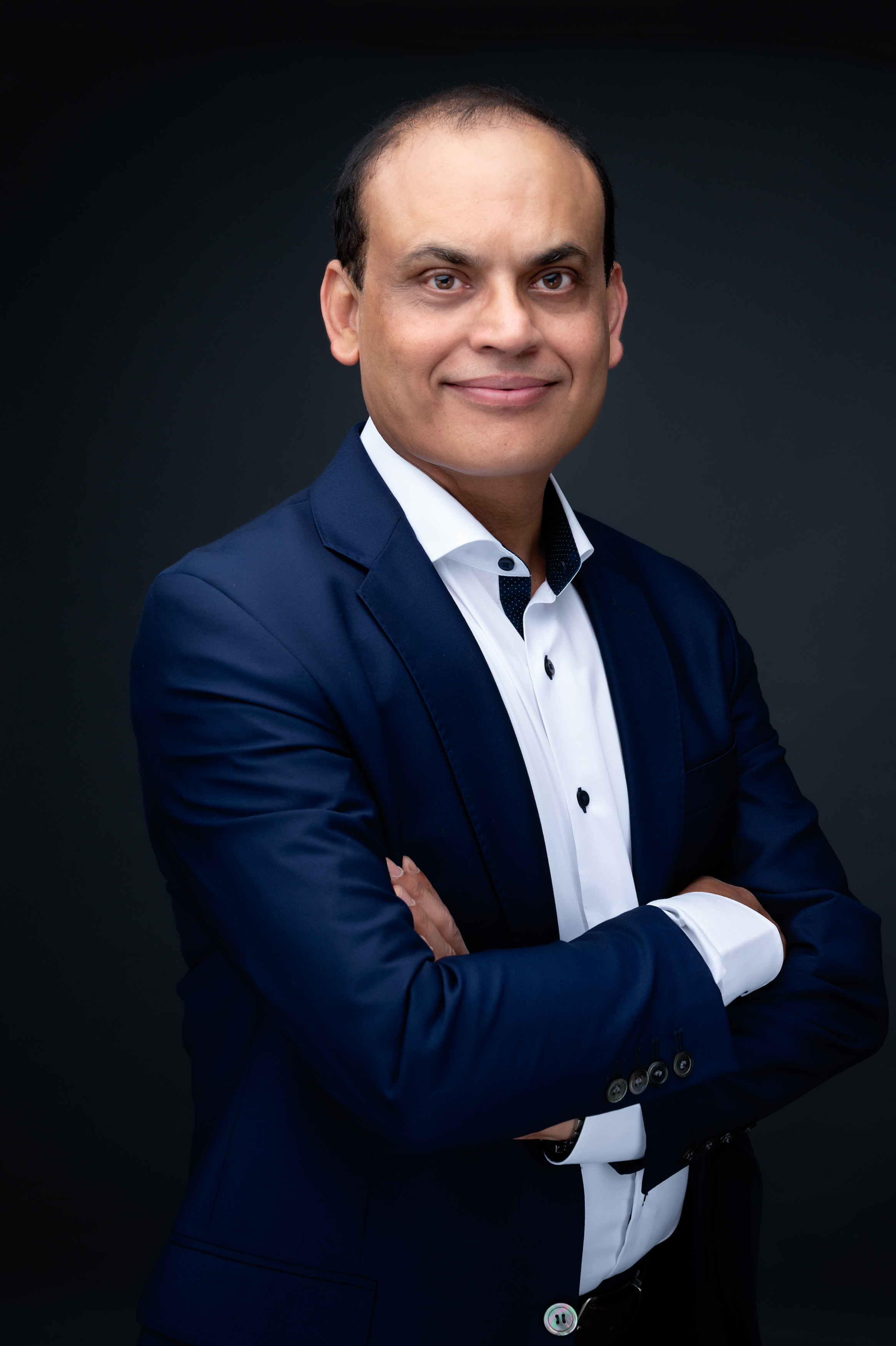 Raj Singh portrait with his arms crossed