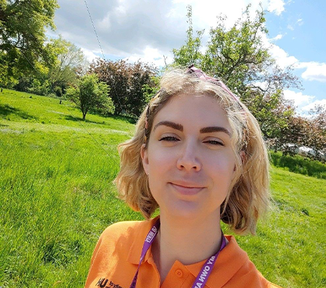 Student smiling outside