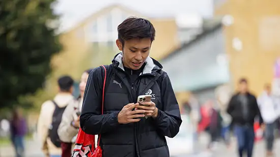 Student looking at their phone